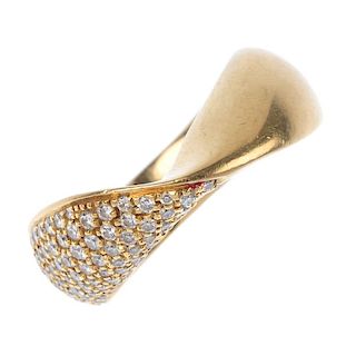 DE BEERS - an 18ct gold diamond dress ring. The twisted band, with pave-set brilliant-cut diamond de