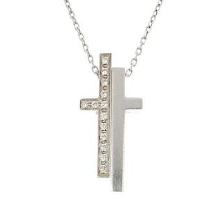 GUCCI - a diamond cross pendant. The brilliant-cut diamond and plain two-part cross, suspended from