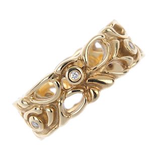 PANDORA - a 14ct gold diamond ring. Of openwork foliate design, with brilliant-cut diamond collet hi