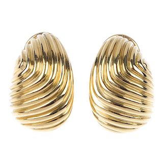 TIFFANY & CO. - a pair of 1970s earrings. Each designed as a grooved scrolling line panel. One signe