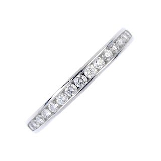 TIFFANY & CO. - a platinum diamond half-circle eternity ring. The brilliant-cut diamond line, within