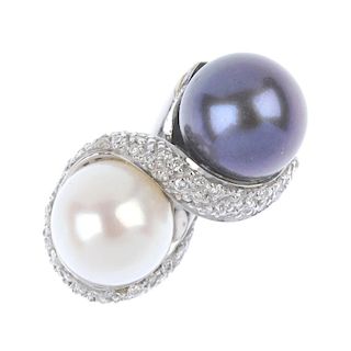 A cultured pearl and diamond dress ring. The black and cream cultured pearls, within a pave-set diam