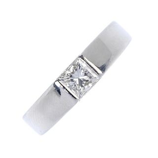A platinum diamond single-stone ring. The square-shape diamond, to the slightly tapered band. Estima