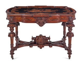 A Victorian Carved, Inlaid and Painted Walnut Writing Desk