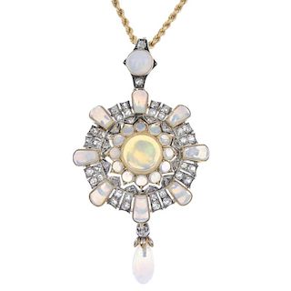 A late 19th century gold and silver opal and diamond pendant. The vari-shape opal, old and rose-cut