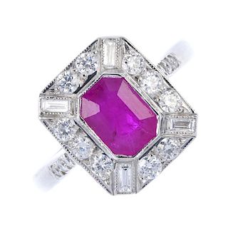 A ruby and diamond cluster ring. The rectangular-shape ruby, within a rectangular-shape and brillian