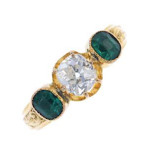 A late 19th century 18ct gold diamond and paste ring. The old-cut diamond, with green paste sides, t
