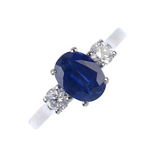 * An 18ct gold sapphire and diamond three-stone ring. The oval-shape sapphire, with brilliant-cut di
