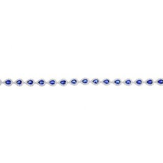 * A sapphire and diamond bracelet. Designed as a series of pear-shape sapphire and brilliant-cut dia
