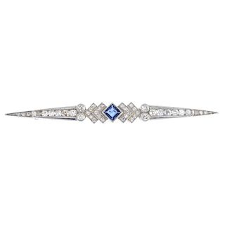 A sapphire and diamond bar brooch. The square-shape sapphire, to the single-cut diamond chevrons and