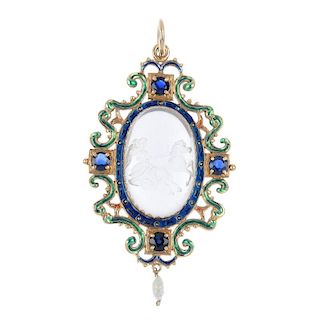A rock crystal and enamel pendant. The oval-shape engraved rock crystal depicting a charioteer, with