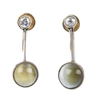 A pair of early 20th century gold chysoberyl and diamond ear pendants. Each designed as a chrysobery