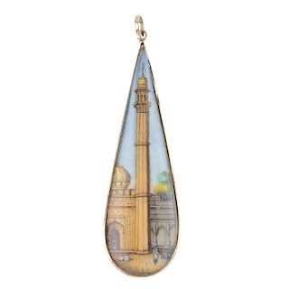 A pendant. Of elongated pear-shape outline, the painted panel depicting an Indian temple minaret sce
