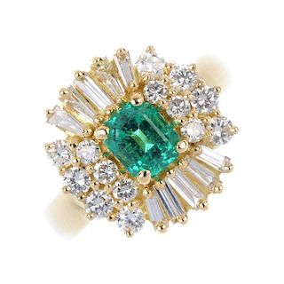 An emerald and diamond cluster ring. The rectangular-shape emerald, within a baguette and brilliant-