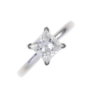 A diamond single-stone ring. The square-shape diamond, to the plain band. Diamond weight 1.04ct, sta
