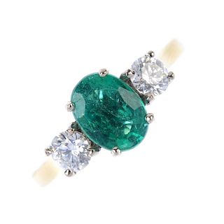 * An 18ct gold emerald and diamond three-stone ring. The oval-shape emerald, to the brilliant-cut di