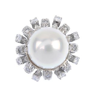 A cultured pearl and and diamond dress ring. The cultured pearl, measuring 12.1mms, within a brillia