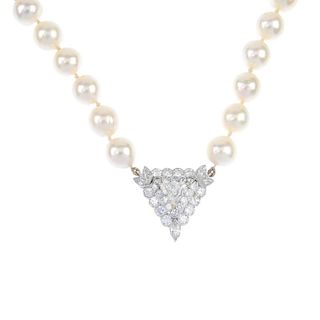 A diamond and cultured pearl single-strand necklace. The triangular-shape diamond, weighing 0.87ct,