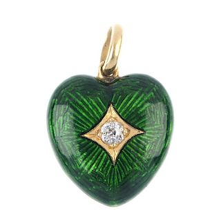 An enamel and diamond pendant. Of heart shape outline, the old-cut diamond star, within a green enam