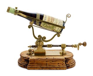 An English Brass and Walnut Port and Wine Bottle Mechanical Decanter
