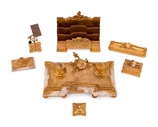A French Gilt Bronze and Onyx Seven-Piece Desk Set by Albert Marionnet (French, 1852-1910)
