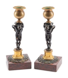 A Pair of French Gilt and Patinated Bronze and Marble Figural Candlesticks in the Form of Atlas