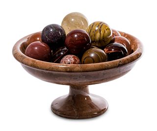 A Turned Marble Center Bowl with a Collection of Spherical Hardstone Ornaments