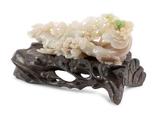 A Chinese Carved Hardstone Sculpture on a Wood Base