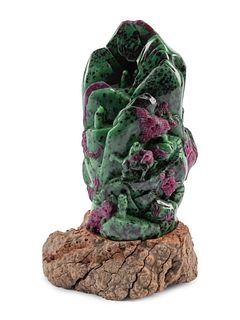 A Chinese Carved Ruby Zoisite Boulder on a Wood Base