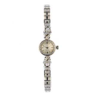 OMEGA - a lady's diamond manual wind watch. The circular-shape grey dial, with baton markers and sin
