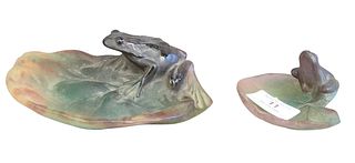 Pair of Daum Glass Frogs on Lily Pads, signed on bottom "Daum, France", lengths: 3 1/4 and 6 1/4 inches.