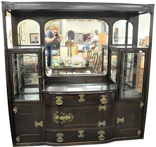 Large Oak Art Nouveau Style Sideboard having mirror back, two curio cabinets, heavy brass hardware, circa 1910, height 80 inches, width 78 1/2 inches,