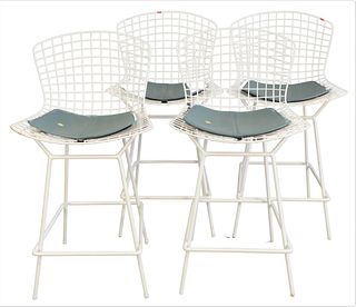 Set of Four Knoll Bertoia White Stools, counter height with vinyl cushion, height 39 inches.