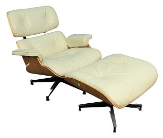 Eames for Herman Miller Chair and Ottoman with white leather upholstery, width 32 inches.