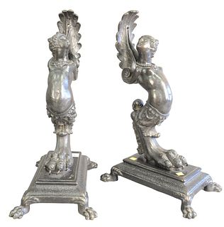 Pair of Iron Partially Clad Women, on claw foot bases, set on platform with paw feet, height 23 inches.