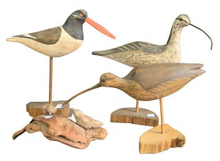Four Piece Lot to include three shore bird decoys, along with one burlwood having two small birds, height 12 1/2 inches.