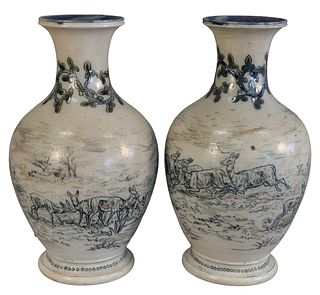 Pair of Doulton Burstem Vases, each with blue, incised deer, height 11 inches, (one chipped, one repaired). Provenance: From a Newport, Rhode Island h