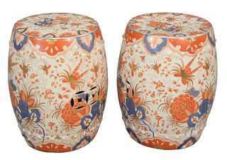 Pair of Garden Seats, Imari pattern, height 18 inches, diameter 12 inches.