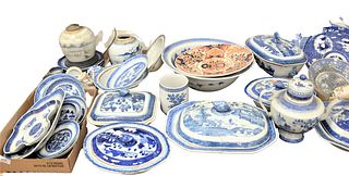 Large group of Canton to include a large wash bowl, six covered tureens, a teapot tankard, along with four tray lots of small plates, dishes, etc., (a