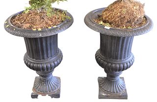 Pair of Victorian Style Iron Urns on square bases, height 30 inches, diameter 23 inches.