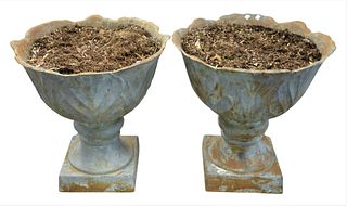 Pair of Iron Urns on square bases, height 24 inches, diameter 24 inches.