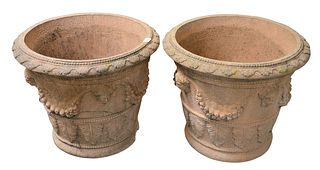 Pair of H.G.C. Red Cast Planters, having moulded mask and wreaths, height 19 1/2 inches, diameter 23 1/2 inches, (one wired and cracked).
