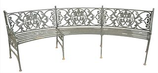 Iron Curved Bench with winged griffin back and slat style seat, length 95 inches.