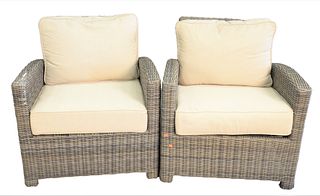 Pair of Woven Patio Armchairs with Sunbrella upholstered cushions, height 33 inches, width 31 inches.