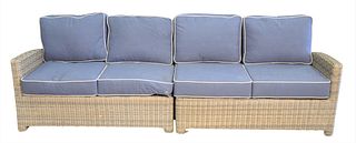 Two Part Woven Outdoor Sofa having Sunbrella upholstered cushions, height 33 inches, length of each 54 inches.
