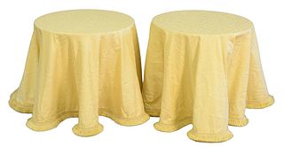 Pair of Round Tables with yellow linen cloth having glass top, height 24 inches, diameter 24 inches.