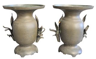 Pair of Bronze Asian Urns having floral handles with overall incised flower decoration, height 12 inches, diameter 9 1/2 inches, (hole under one handl