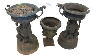Three Piece Lot to include pair of Victorian iron urns with bird supports and handles, along with Victorian urn with Putti and faces, height 31 inches