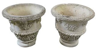 Pair of Concrete Urns with faces and wreaths, signed Nina Studio P249, height 22 inches, width 23 inches.
