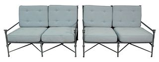 Pair of Restoration Hardware Outdoor Loveseats having upholstered cushions, height 32 1/2 inches, length 52 inches.